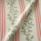 Printed linen fabric with pink and green stripes and an oak-leaf motif.