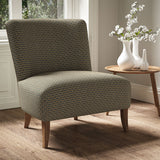 Armchair in a printed linen fabric with textural weave pattern in brown and blue colours.