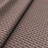 Printed linen fabric with textural weave pattern in pink and black colours for upholstery.