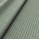 Printed linen fabric with textural weave pattern in blue and yellow colours for upholstery.