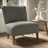 Armchair in a printed linen fabric with textural weave pattern in beige colours.