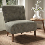 Armchair in a printed linen fabric with textural weave pattern in brown and blue colours.