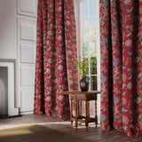 Curtains in a printed linen fabric with tree of life design in red and blue colours.