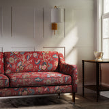 Sofa in a printed linen fabric with tree of life design in red and blue colours.