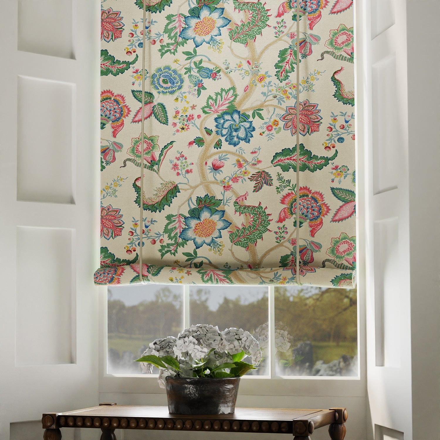 Blind in a printed linen fabric with tree of life design in multicolours.