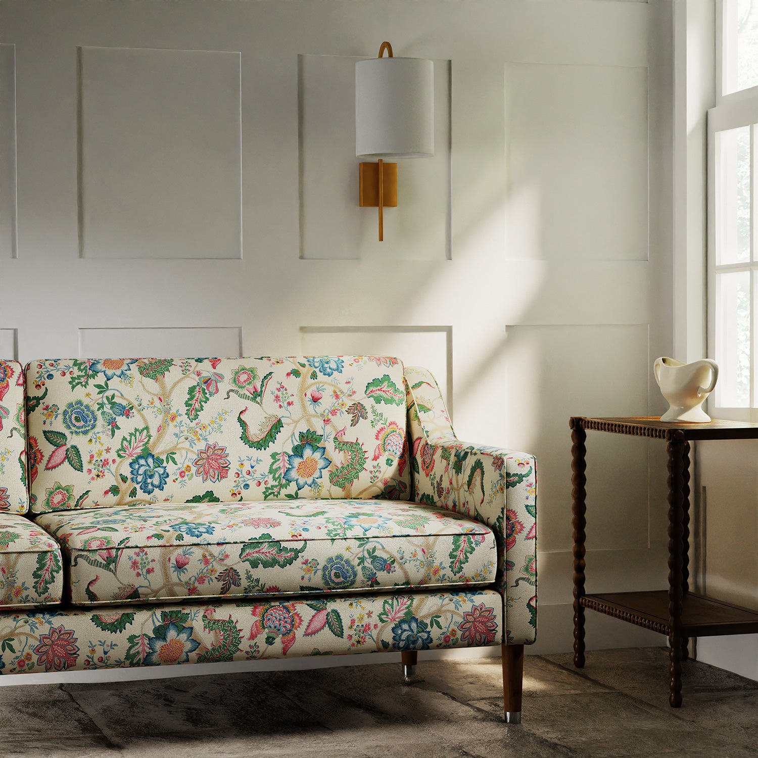 Sofa in a printed linen fabric with tree of life design in multicolours.