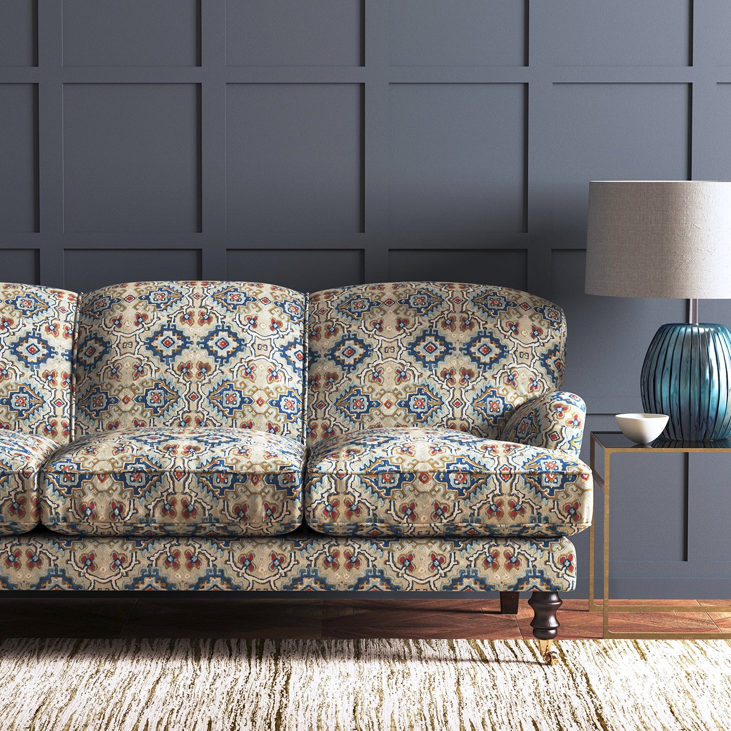 Velvet sofa upholstered in a printed velvet fabric with an oriental geometric design in blue colours