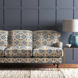 Velvet sofa upholstered in a printed velvet fabric with an oriental geometric design in blue colours