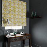 Velvet blind upholstered in a printed velvet fabric with an oriental geometric design in yellow colours