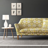Velvet sofa upholstered in a printed velvet fabric with an oriental geometric design in yellow colours