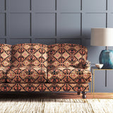 Velvet sofa upholstered in a printed velvet fabric with an oriental geometric design in multicolours