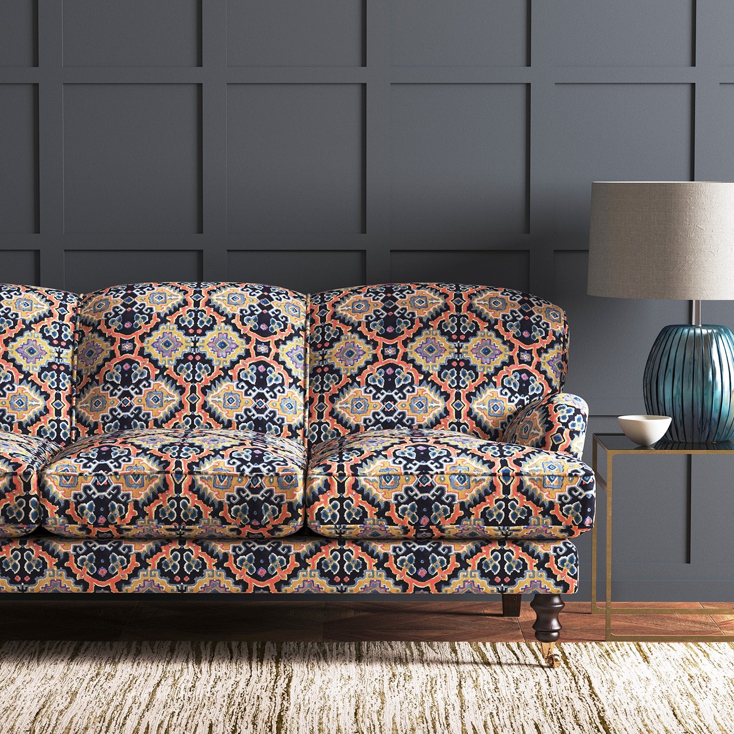 Velvet sofa upholstered in a printed velvet fabric with an oriental geometric design in multicolours