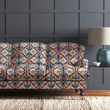 Velvet sofa upholstered in a printed velvet fabric with an oriental geometric design in multicolours