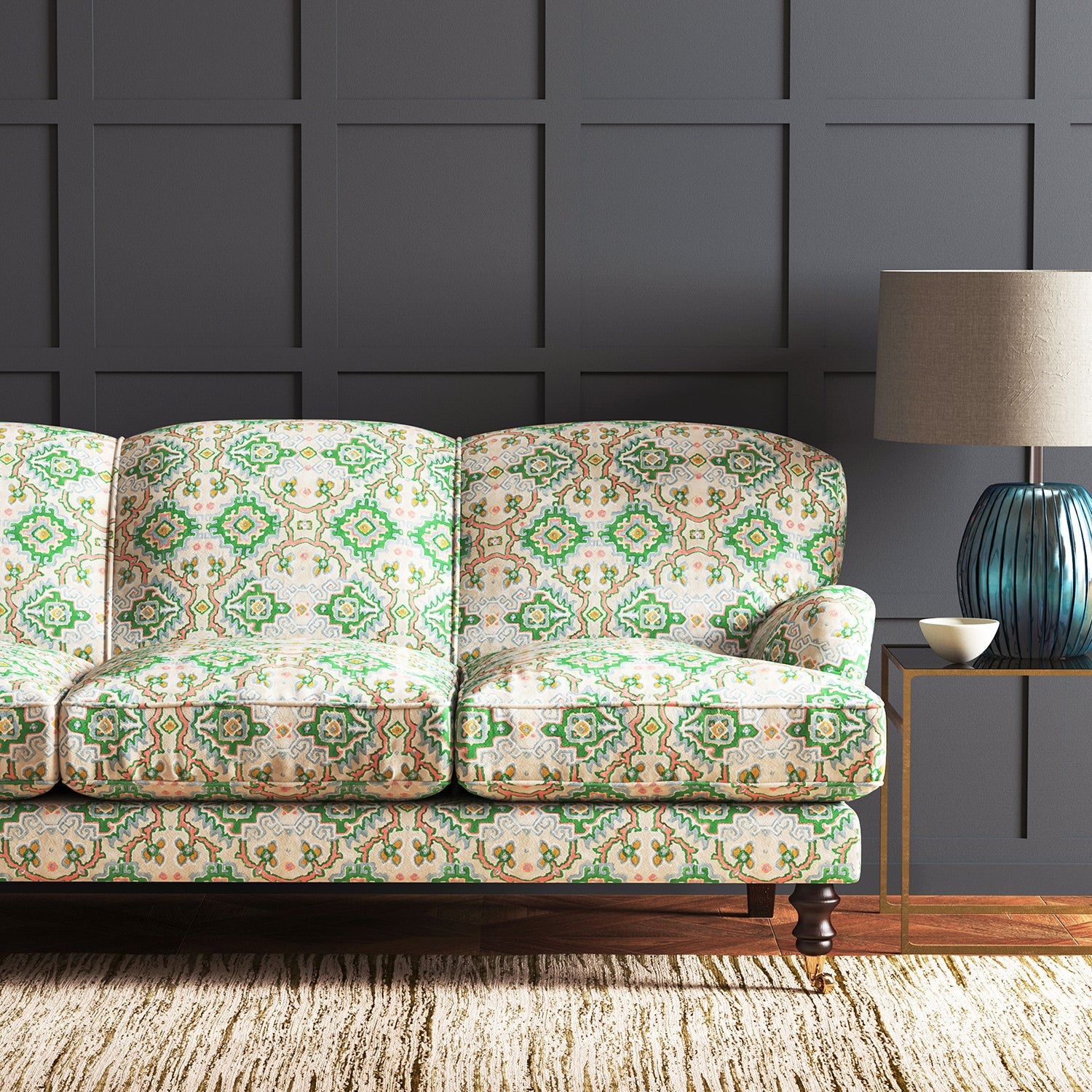 Velvet sofa upholstered in a printed velvet fabric with an oriental geometric design in multicolours