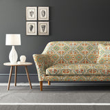 Velvet sofa upholstered in a printed velvet fabric with an oriental geometric design in multicolours