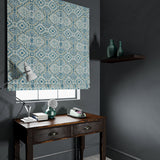 Velvet blind upholstered in a printed velvet fabric with an oriental geometric design in blue colours