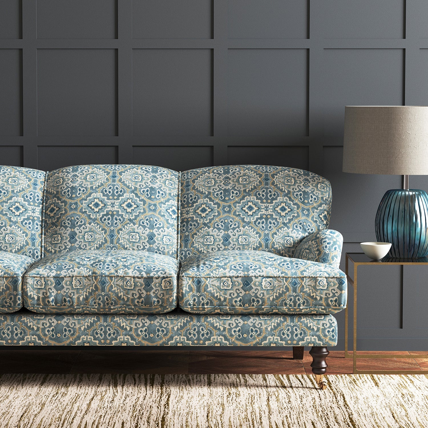 Velvet sofa upholstered in a printed velvet fabric with an oriental geometric design in blue colours