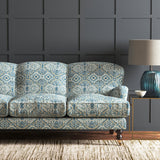 Velvet sofa upholstered in a printed velvet fabric with an oriental geometric design in blue colours