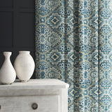 Velvet curtain in a printed velvet fabric with an oriental geometric design in blue colours