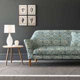 Velvet sofa upholstered in a printed velvet fabric with an oriental geometric design in blue colours
