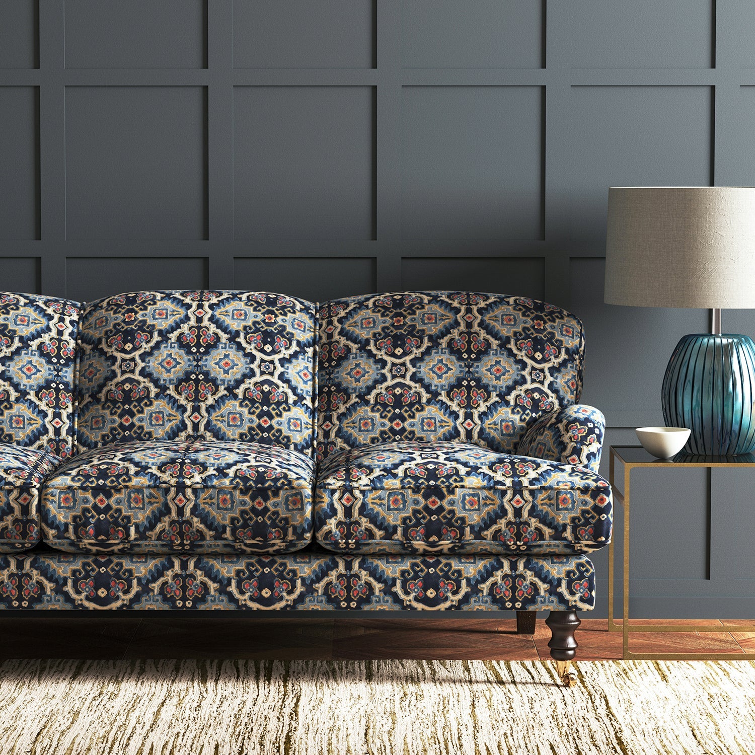 Velvet sofa upholstered in a printed velvet fabric with an oriental geometric design in blue colours