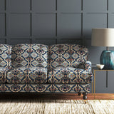 Velvet sofa upholstered in a printed velvet fabric with an oriental geometric design in blue colours