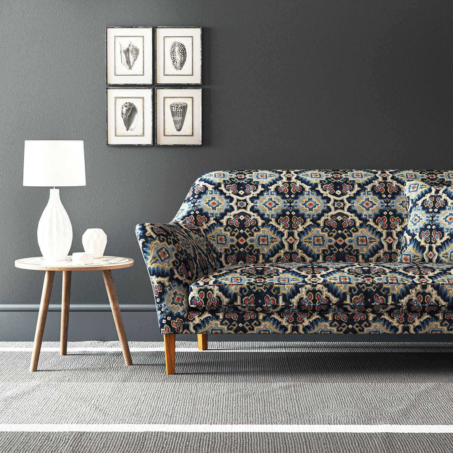 Velvet sofa upholstered in a printed velvet fabric with an oriental geometric design in blue colours