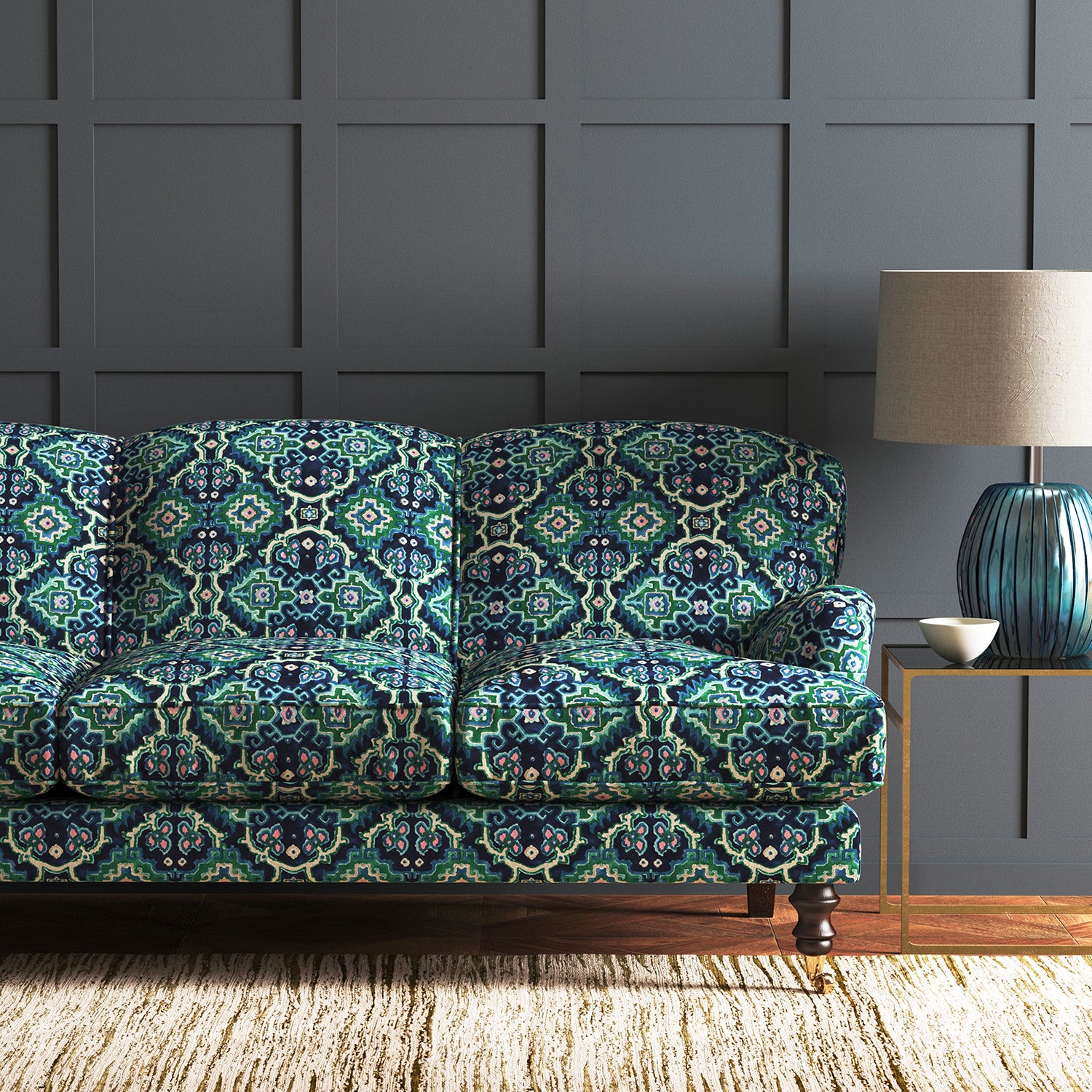 Velvet sofa upholstered in a printed velvet fabric with an oriental geometric design in blue and green colours