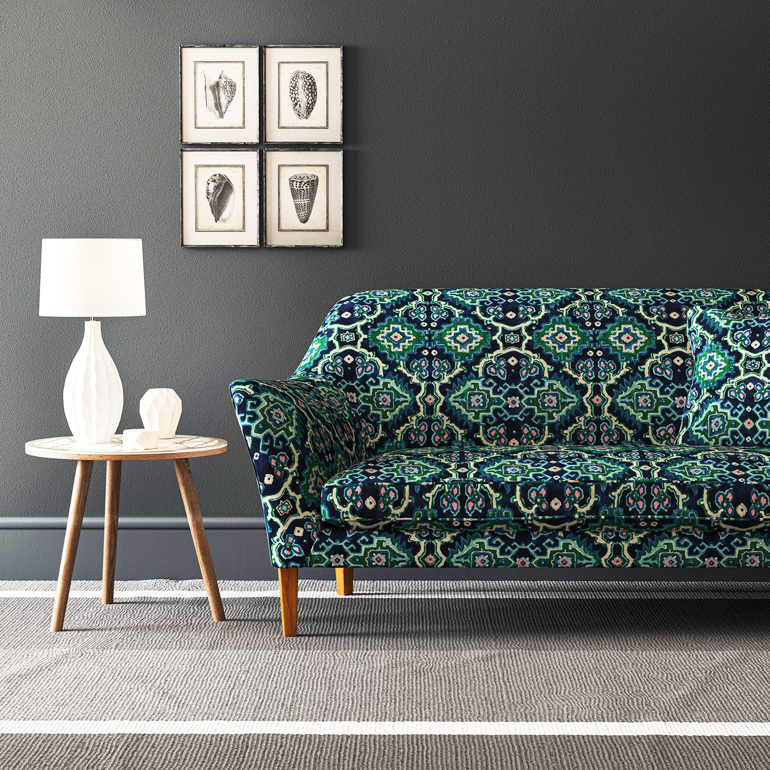 Velvet sofa upholstered in a printed velvet fabric with an oriental geometric design in blue and green colours