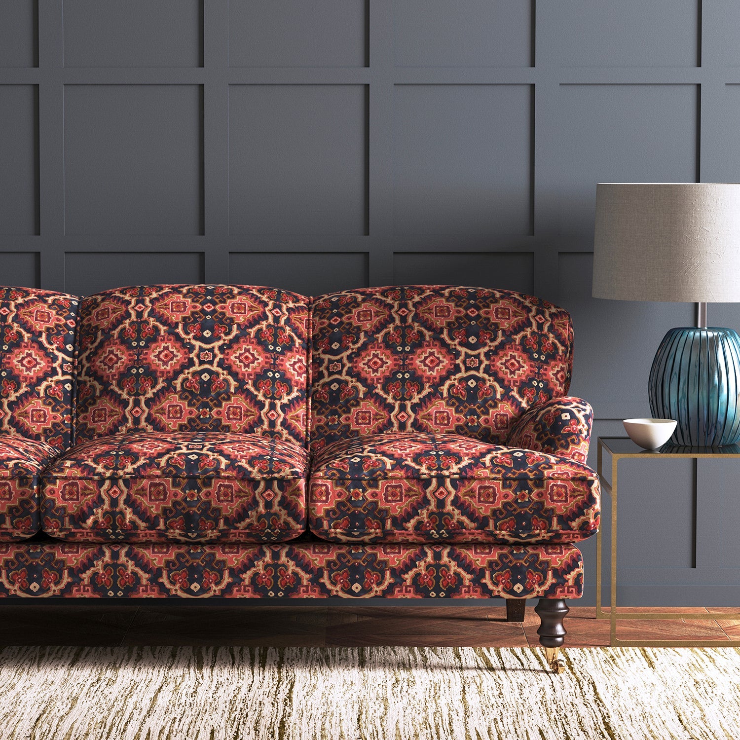 Velvet sofa upholstered in a printed velvet fabric with an oriental geometric design in red colours