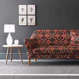 Velvet sofa upholstered in a printed velvet fabric with an oriental geometric design in red colours