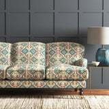 Velvet sofa upholstered in a printed velvet fabric with an oriental geometric design in blue colours