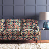 Velvet sofa upholstered in a printed velvet fabric with an oriental geometric design in multicolours
