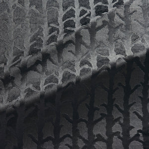 Fabric swatch of a dark grey velvet fabric with abstract branch design, suitable for curtains and upholstery 