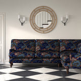 Velvet sofa upholstered in a printed velvet fabric with enchanting landscape of abstract clouds design in multicolours.