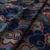 Printed velvet fabric with enchanting landscape of abstract clouds design in multicolours, for upholstery and curtain use.