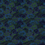 Printed velvet fabric with enchanting landscape of abstract clouds design in blue and green colours, for upholstery and curtain use.
