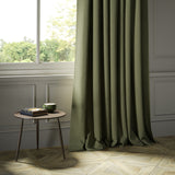 Curtains in a dark green Scottish wool herringbone fabric