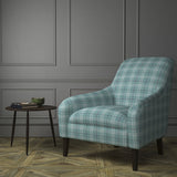 Chair upholstered in a blue Scottish wool plaid check fabric