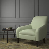 Chair upholstered in a luxury Scottish plain light green wool upholstery fabric