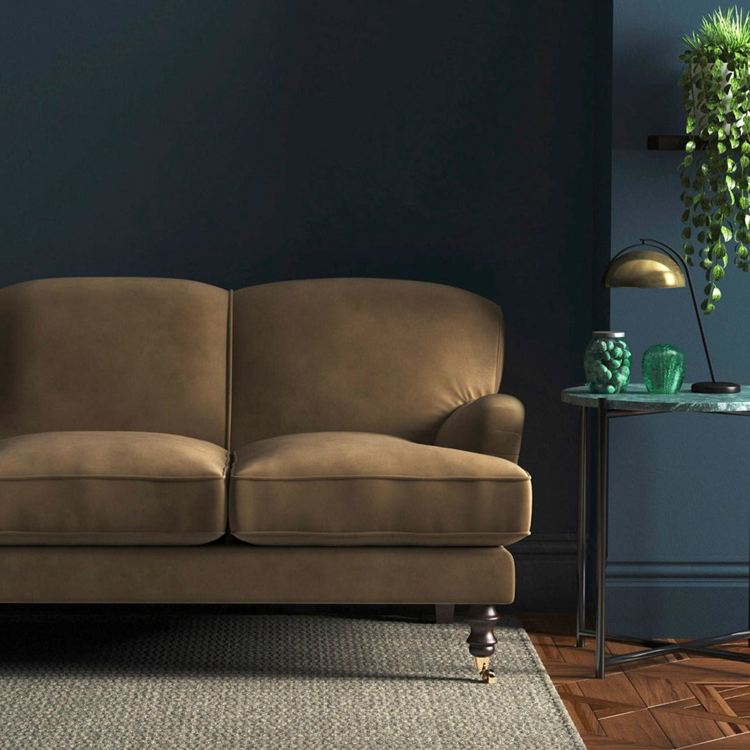 Sofa covered in a brown velvet upholstery fabric