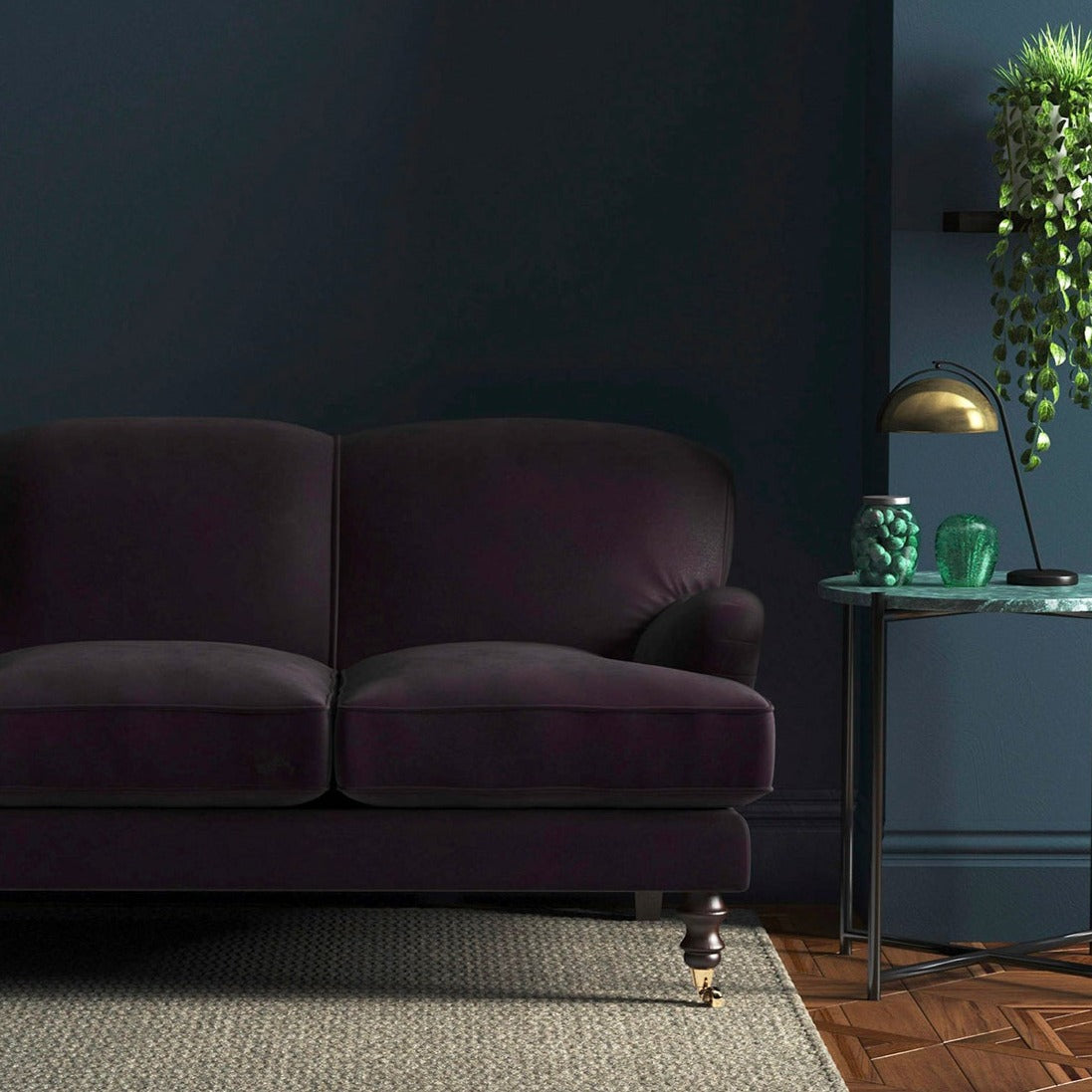 Sofa covered in a purple velvet upholstery fabric