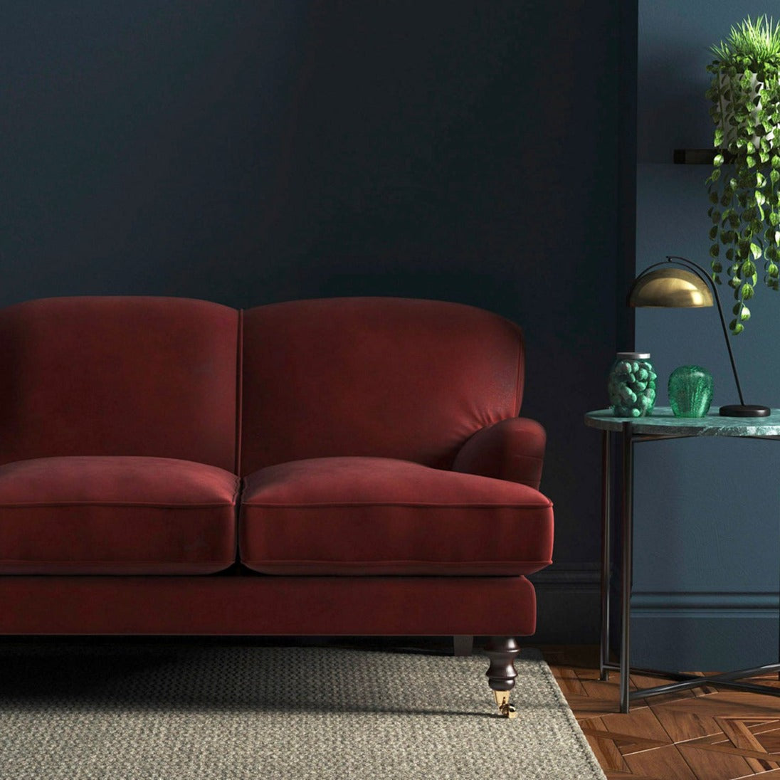 Sofa covered in a red velvet upholstery fabric