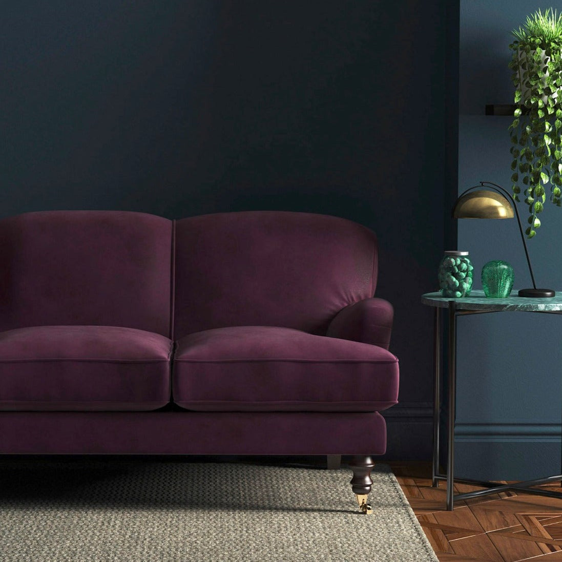 Sofa covered in a purple velvet upholstery fabric