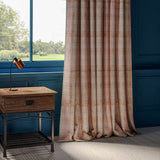 Curtains in a red and neutral check with light, woven large scale damask design.