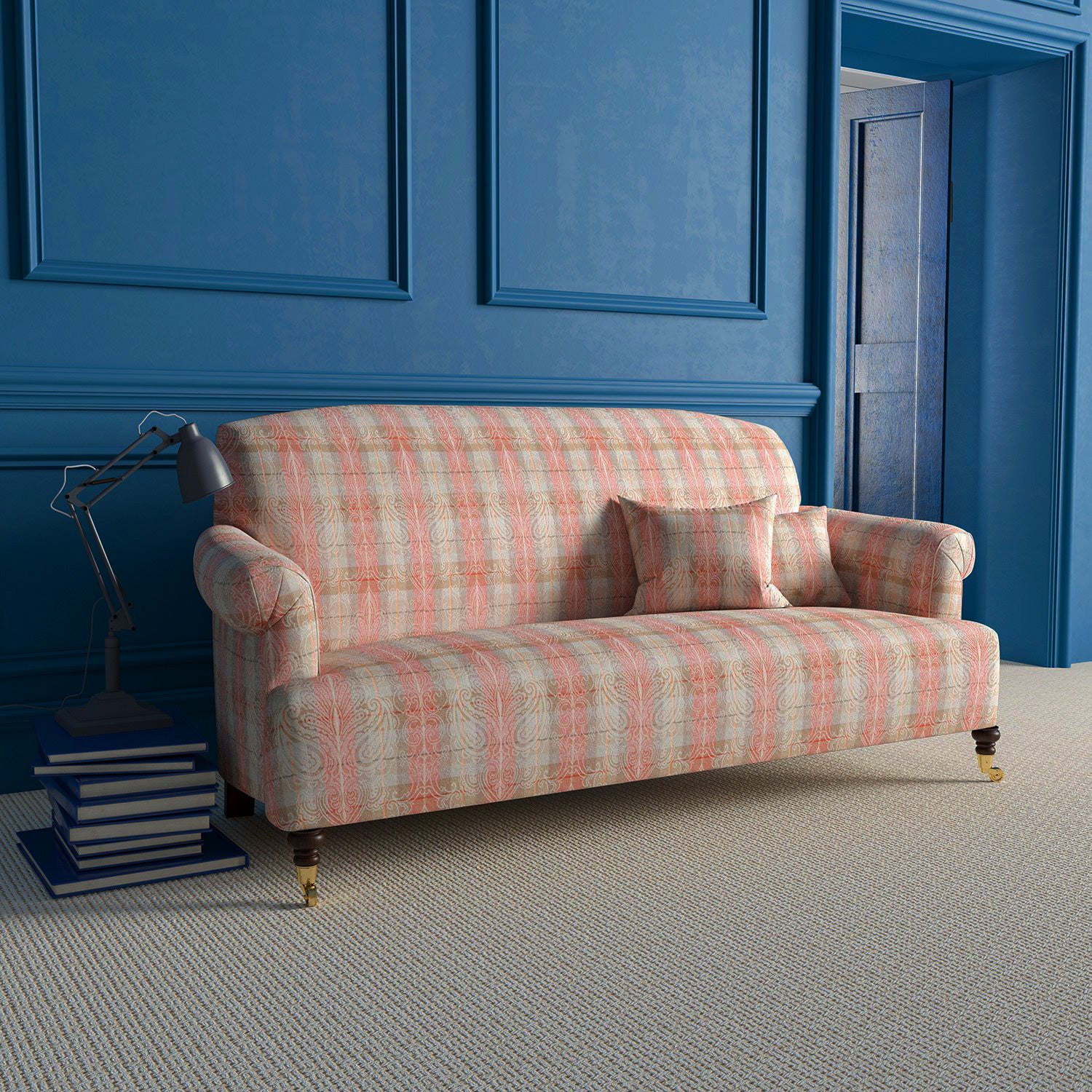 Sofa upholstered in light red and neutral wool check fabric with large white woven damask print.
