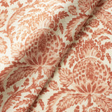 Fabric swatch of a light red vintage inspired floral and leaf design fabric for curtains and upholstery