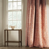 Curtains in a classic light red floral and leaf fabric