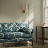 Sofa upholstered in a luxury blue floral damask fabric