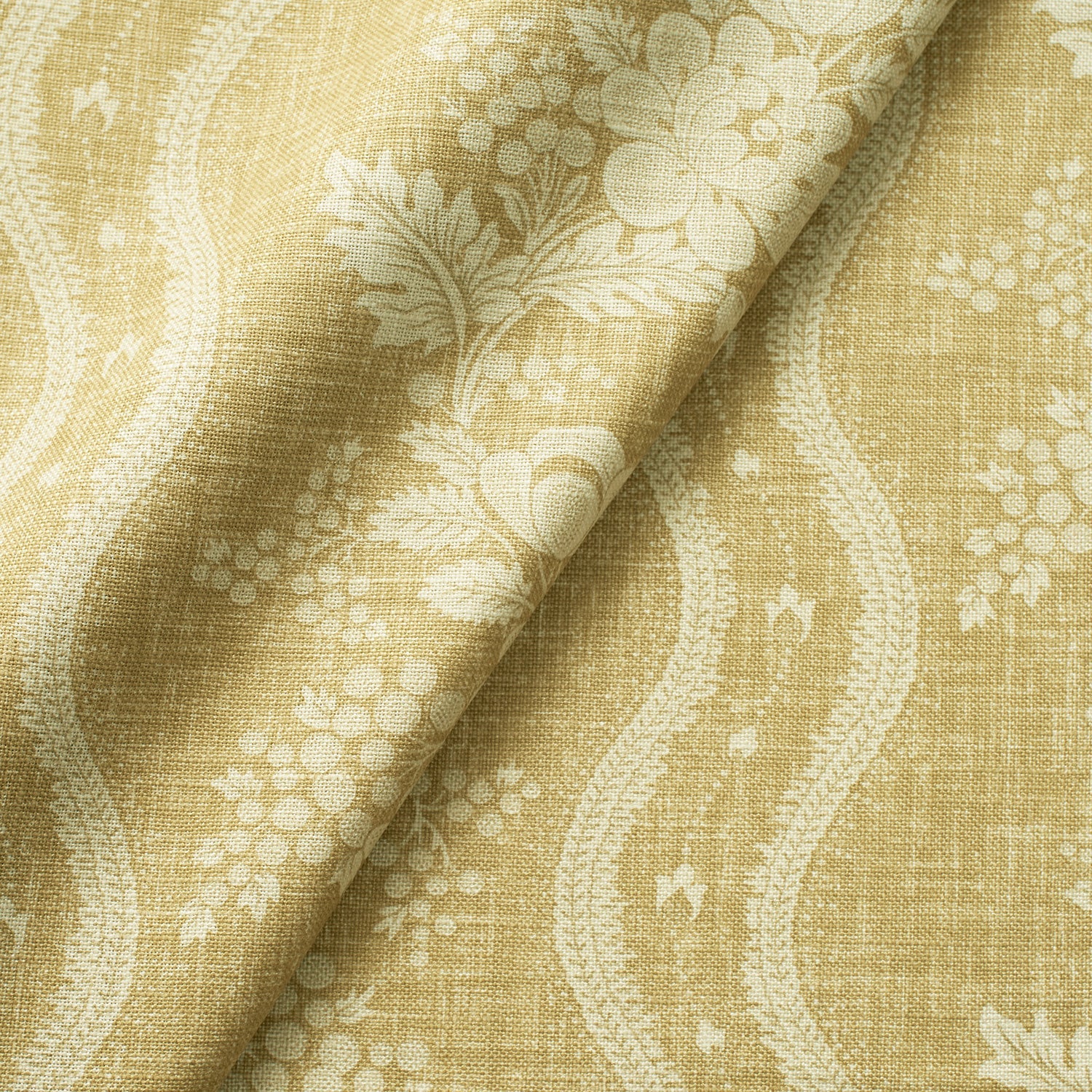 Fabric swatch of a yellow floral fabric with striped design for curtains and upholstery